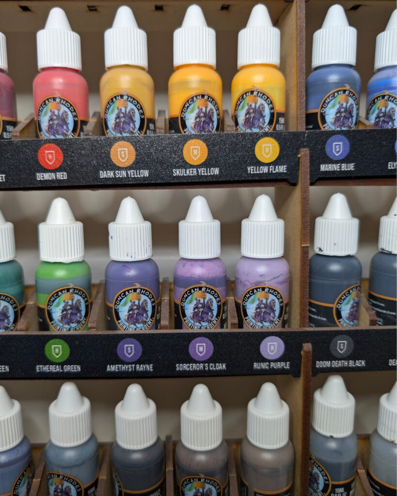 Front-facing paint display with labels clearly visible